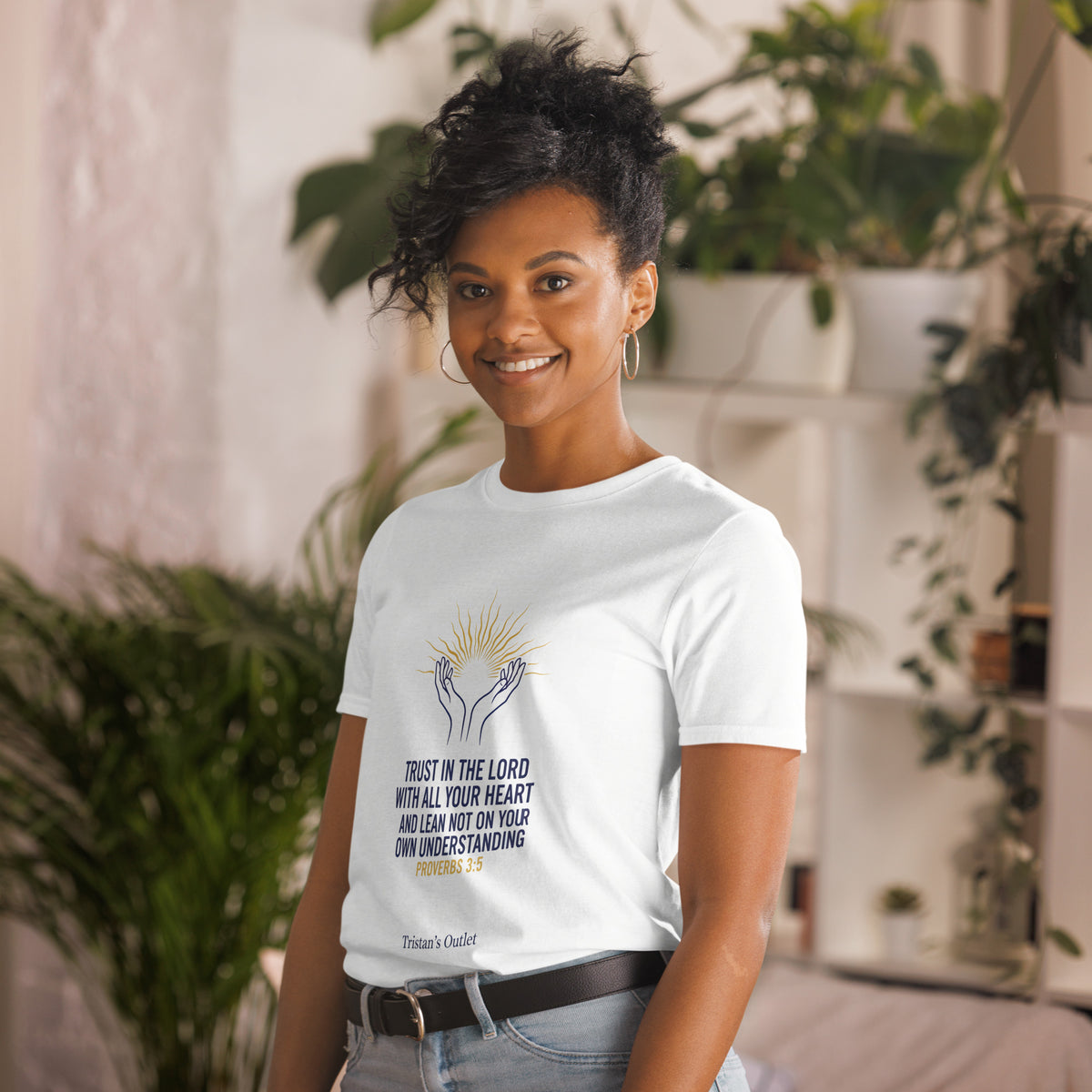 White unisex short-sleeve T-shirt from Tristan's Outlet, shown from the front left side, made of soft, comfortable fabric.