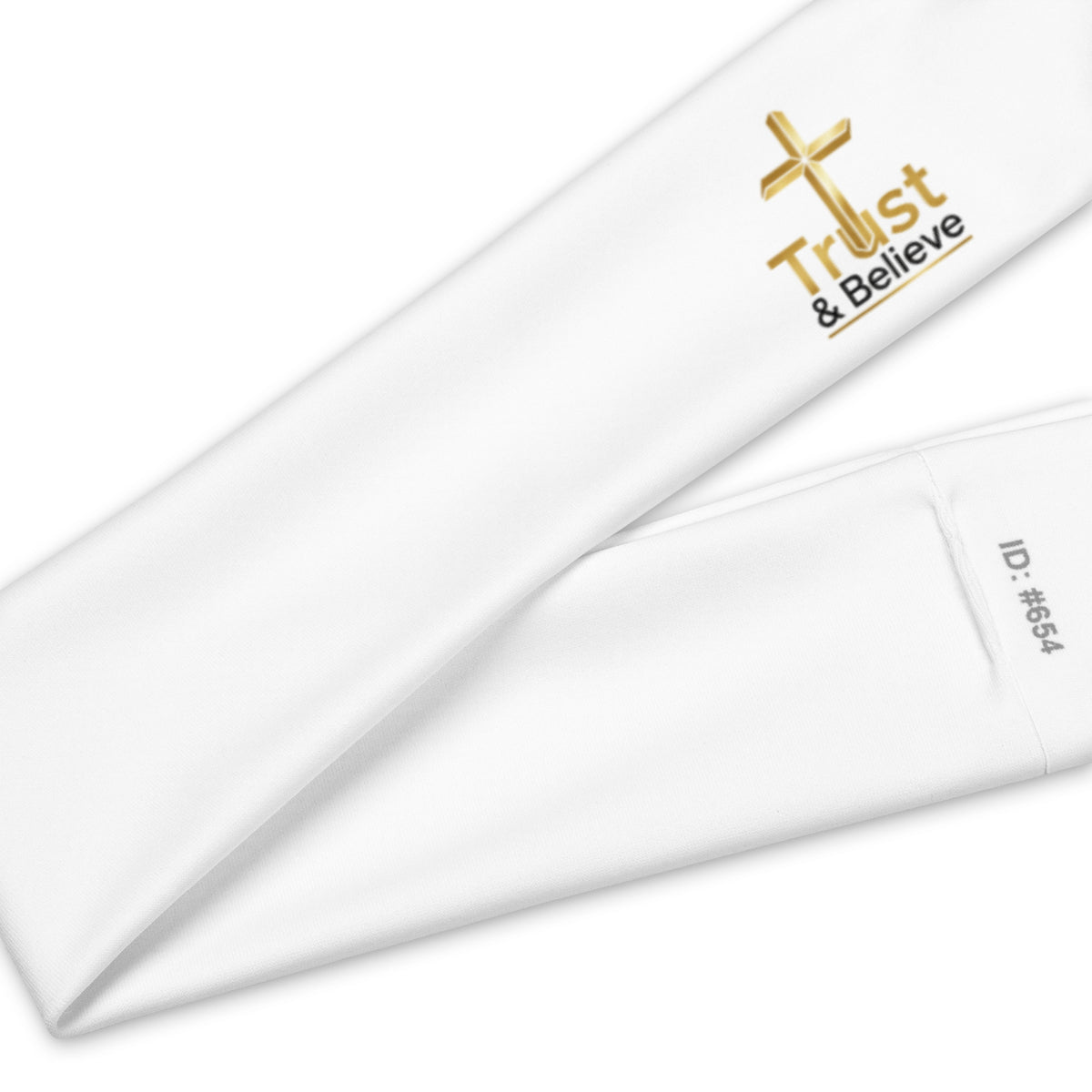 White Trust & Believe headband by Tristan's Outlet featuring an all-over print pattern, ideal for stylish everyday wear.