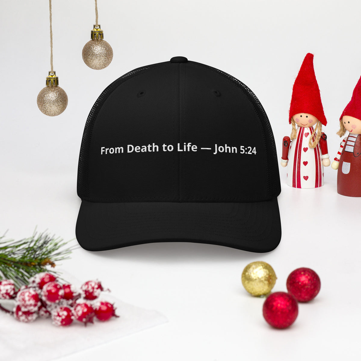 Black retro trucker hat with "From Death to Life" and John 5:24 scripture, featuring a mesh back and structured front panel.