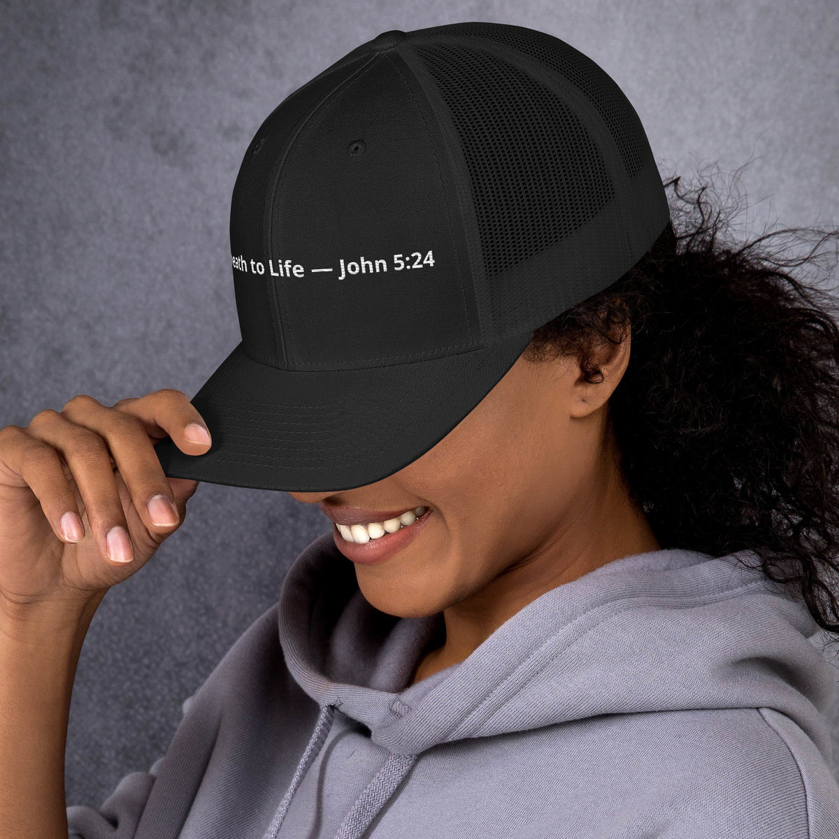 Black retro trucker hat featuring Christian scripture from John 5:24 with "From Death to Life" design.