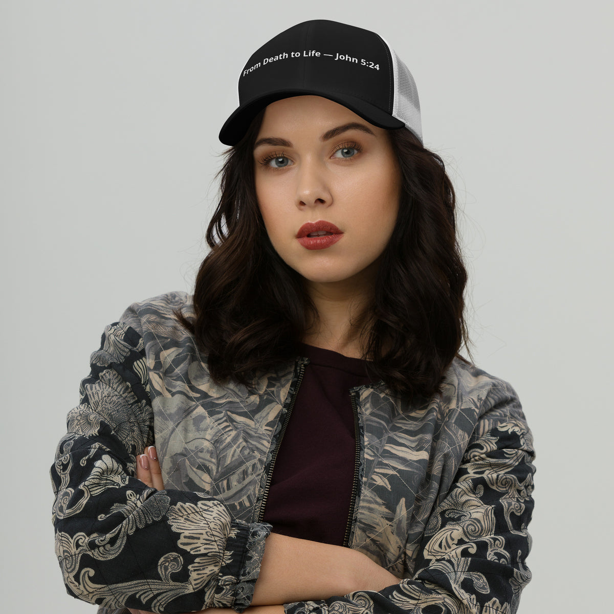 Black and white trucker hat featuring the "From Death to Life" design with John 5:24 scripture, styled as a retro Christian hat.