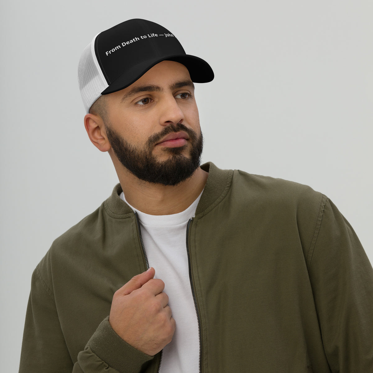 Black and white retro trucker hat featuring "From Death to Life" and John 5:24 text, with mesh back and structured front.