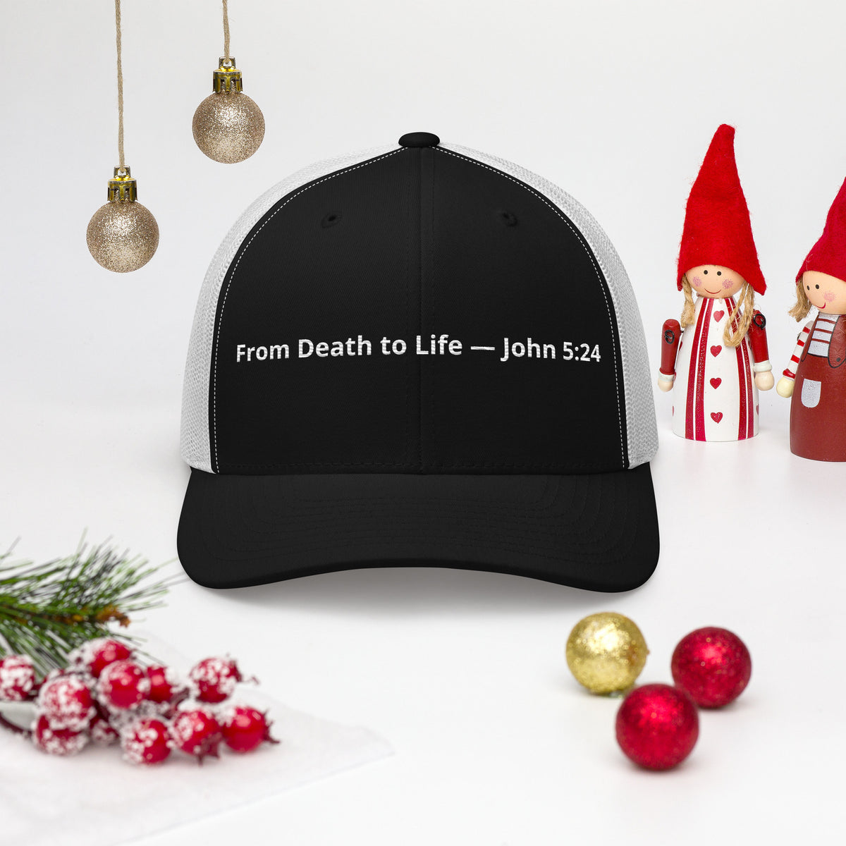 Black and white trucker hat featuring "From Death to Life" and John 5:24 scripture, styled as a retro Christian-themed hat.