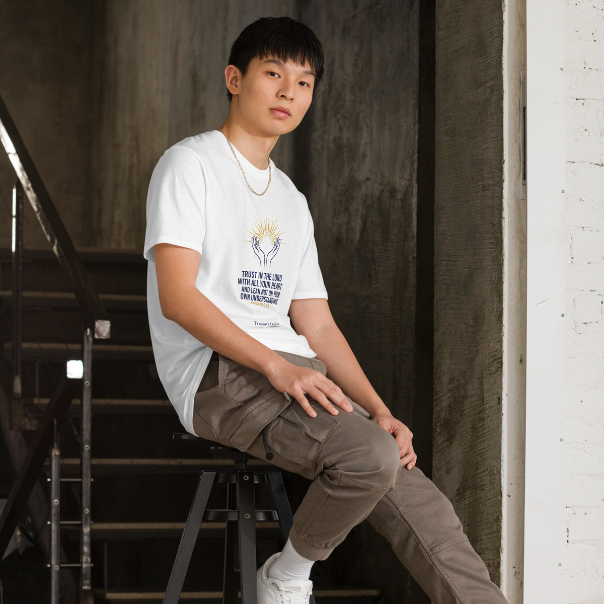 White unisex short-sleeve T-shirt from Tristan's Outlet, showing the right front view with a soft, casual fit.