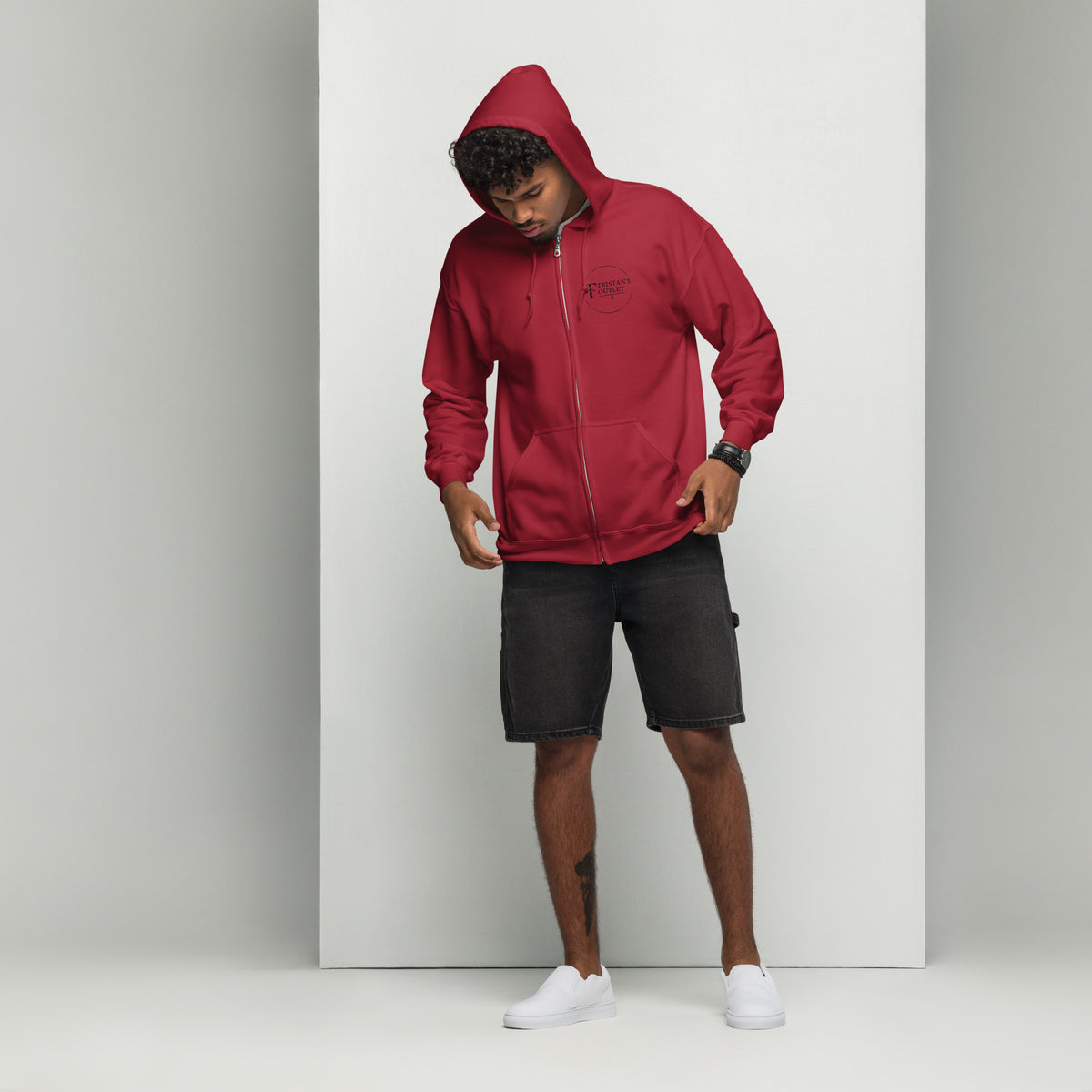 Unisex Tristan's Outlet Cardinal Red zip hoodie with front design, heavy blend fabric, casual style, and adjustable drawstrings.