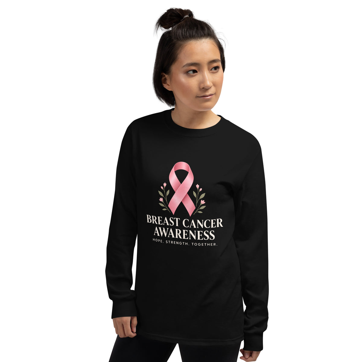 Black unisex long-sleeve shirt from Tristan's Outlet supporting breast cancer awareness with a front-left logo design.