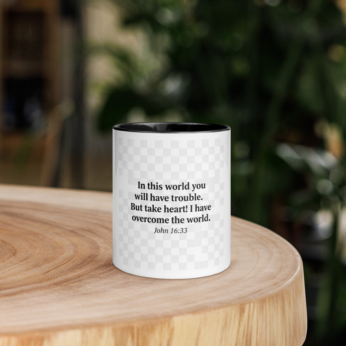 White ceramic mug with black interior, 11 oz, featuring the message "I Have Overcome the World" in black lettering.