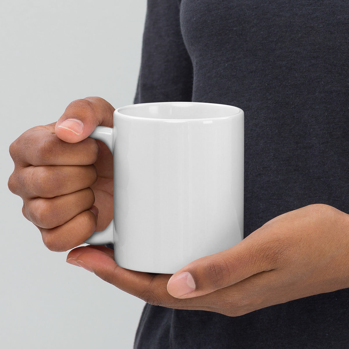 White 11 oz ceramic mug with a handle on the left, featuring "Dad – The Family's Armor Bearer" text, by Tristan's Outlet.